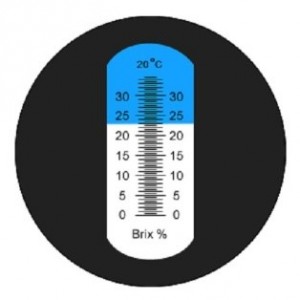 het beeld van een suikermeting met de suikerrefractometre